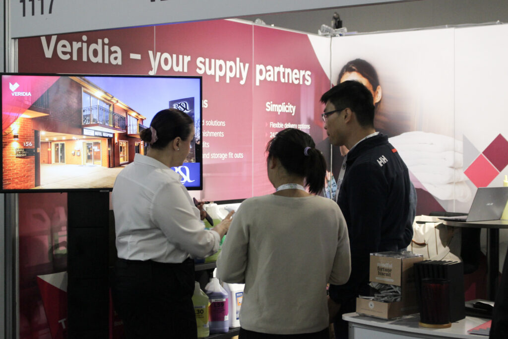 Veridia team member, Lenka (left) talking to two NoVacancy visitors