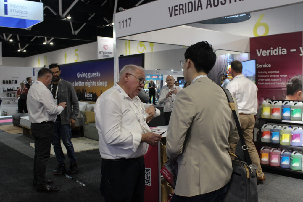 Veridia team member Matthew (middle left) talking to a NoVacancy visitor